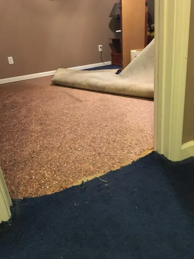 Carpet pad removal revealing water damage during Water Mitigation Services in Sun Lakes