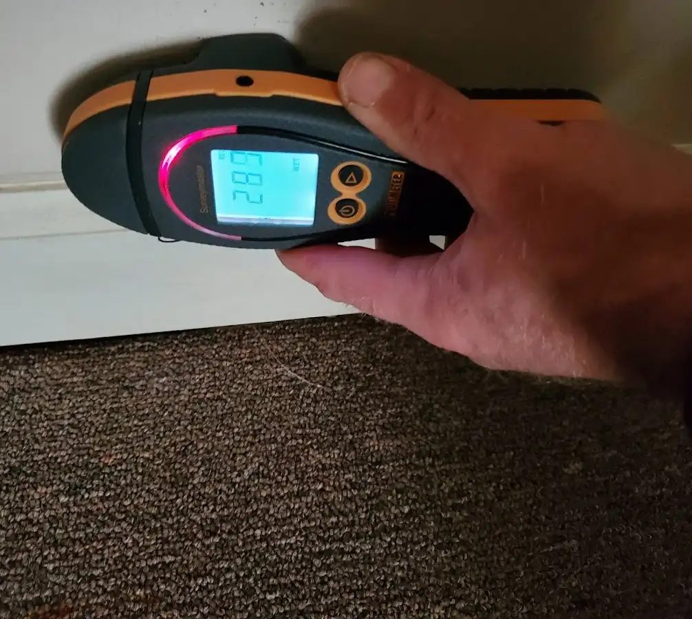 Moisture detection at baseboard during Storm Damage Restoration in Sun Lakes